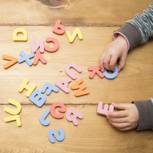 Child playing with Foam Alphabet Pieces